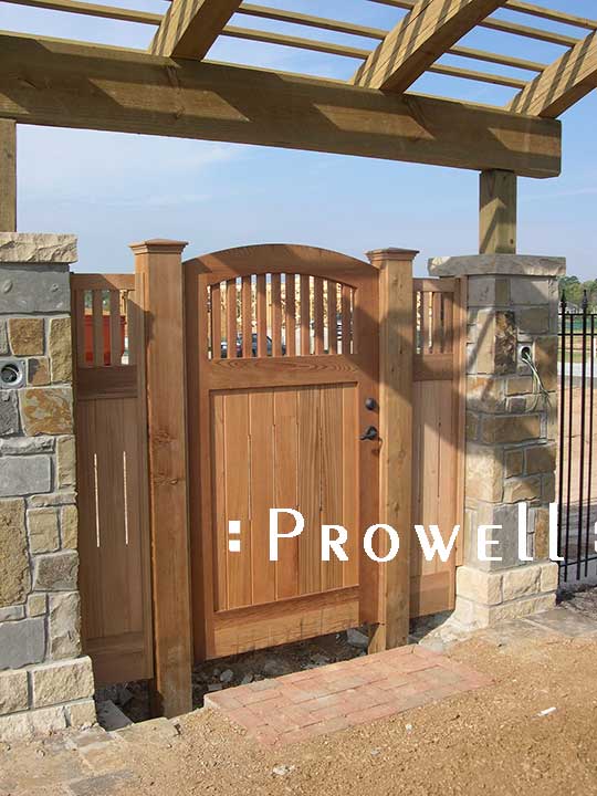 wood gate with flanking panels