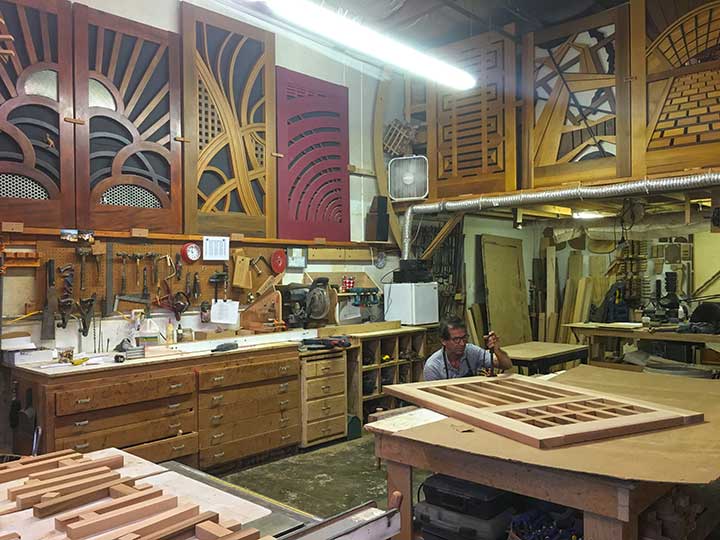 shop photo showing Charles branding the gate design #82. 