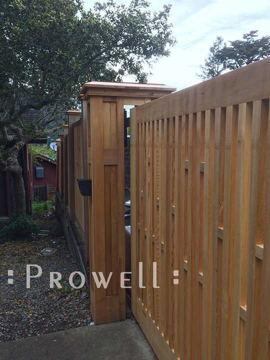 site photograph showing the double wooden driveway gates #4 sliding through the columns in California