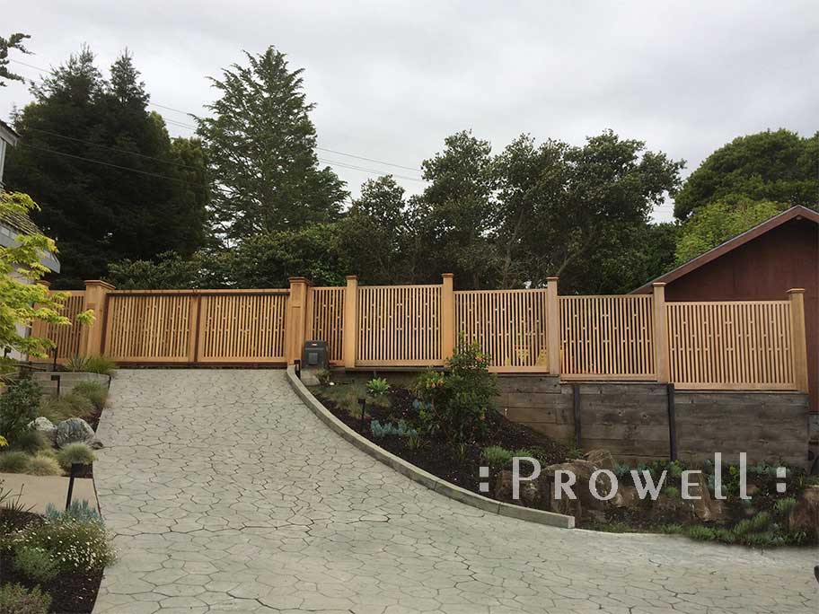 wood drivewasy gate with lighted gate columns in mill valley, ca