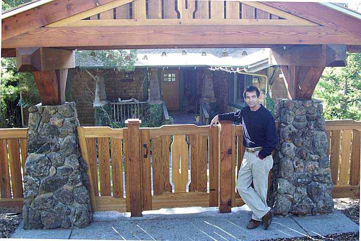 Site photograph showing Charles on site with the arts and crafts gate #90.