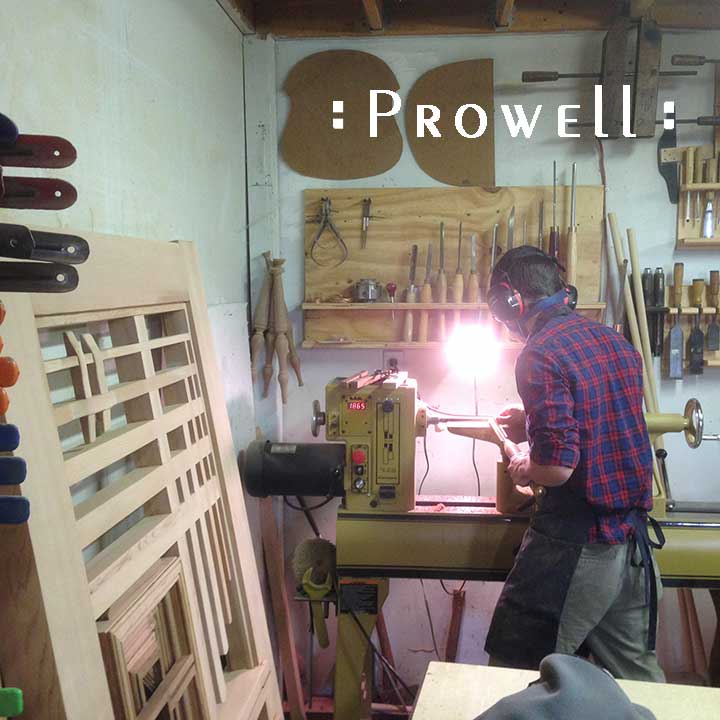 Shop photo showing Ben turning spindles on the lathe for #115,