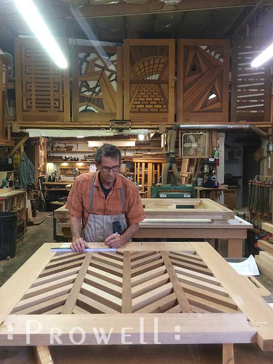 shop photograph with Charles building the wood gate #11