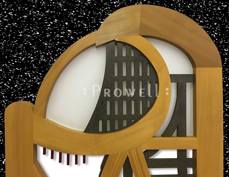 cropped photo showing a close-up of the plexiglas panel on the Artistic wood gates #200-A