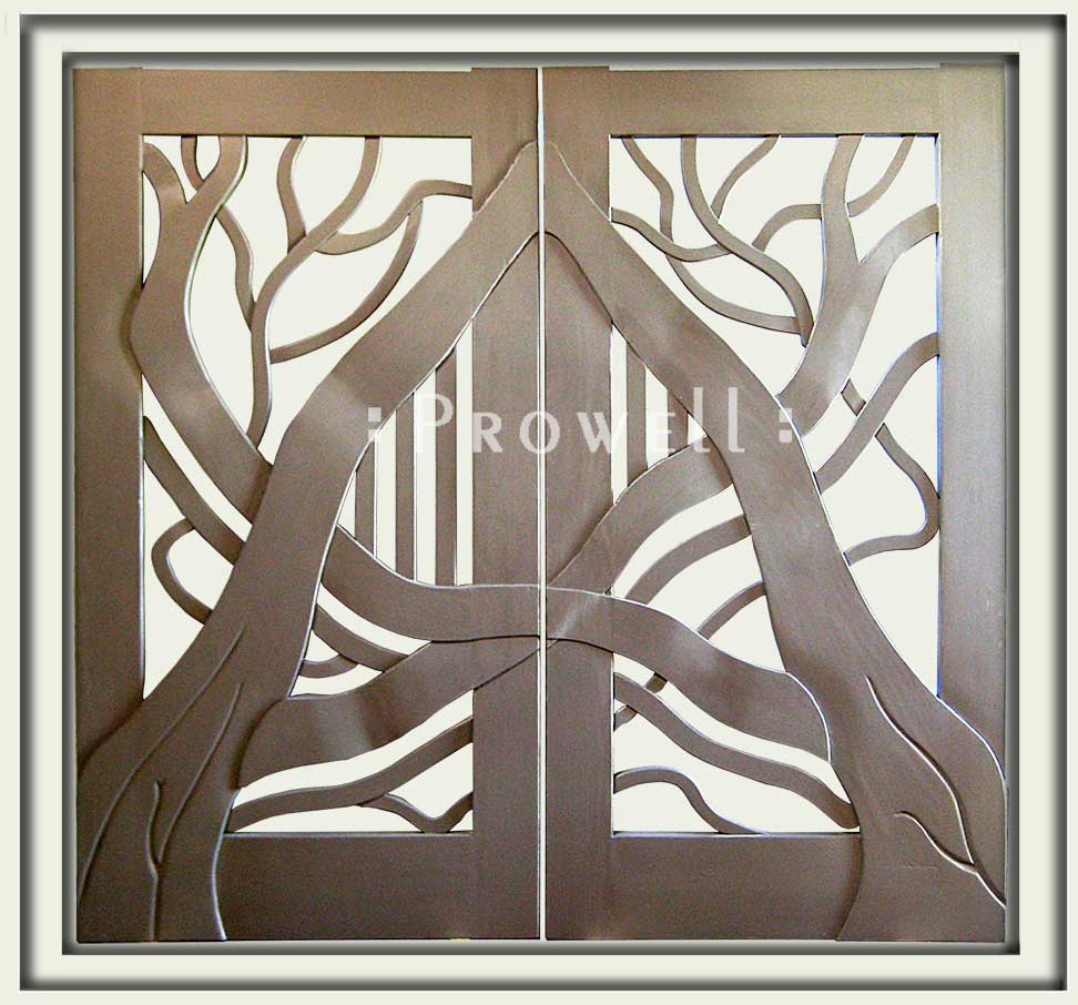 cropped photo showing the hand-carved wood gates #204