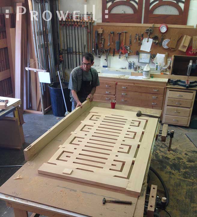 shop progress photograph showing Charles with the final assembly of the postmodern gate #207