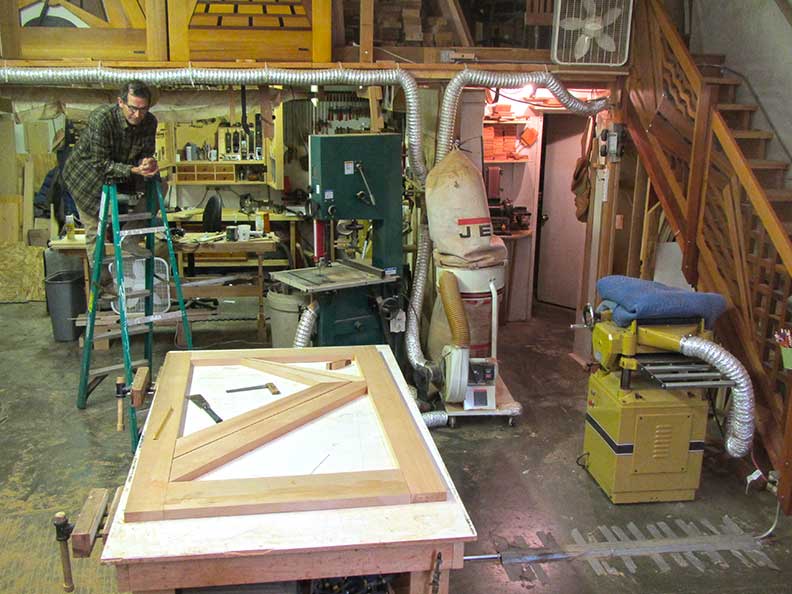shop photo showing harles with the early stages of building the modern entry gate #212