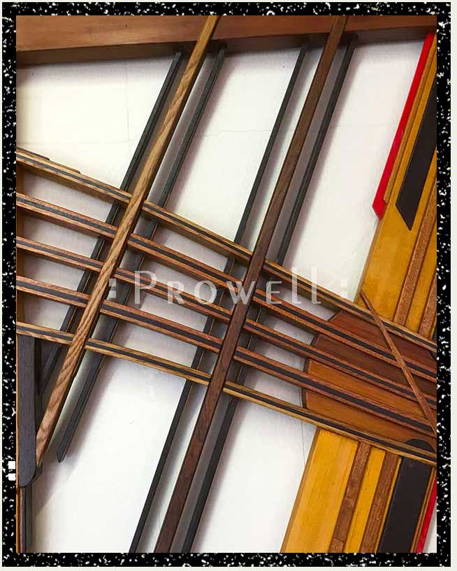 cropped close-up photograph showing the center laminate ribbons of modern gate and fence #213