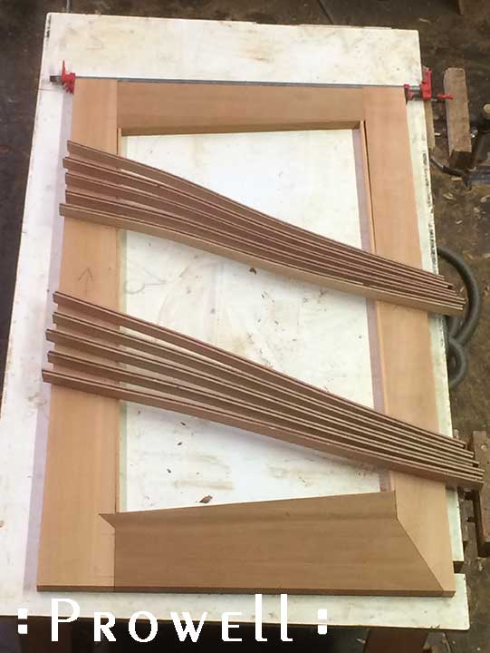 shop progress photograph showing the lamination assembly of the modern gate and fence #213