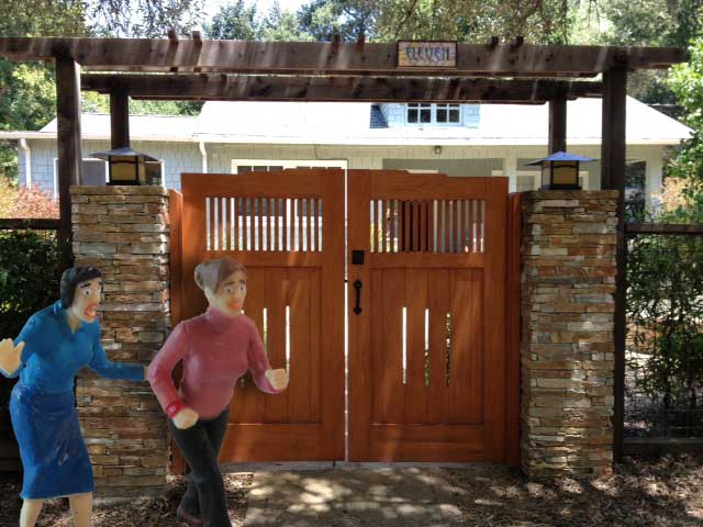 A site image showing the #24 wood gates and two humorous figures.