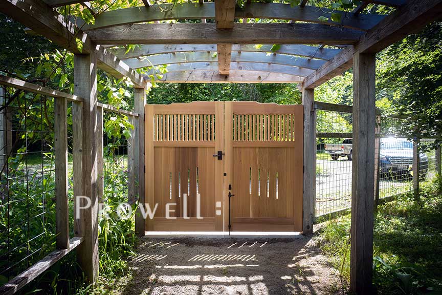 site photo showing the craftsman wooden gates 24-5 from within the property in washington state