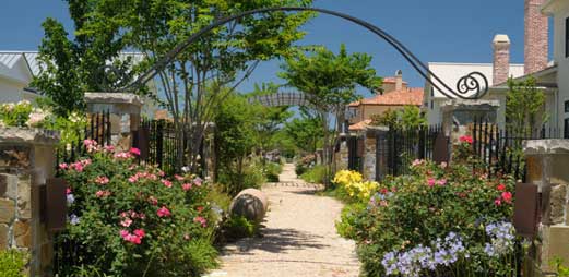 Site photo showing the community walkway with wood gates #29 in Houston, Texas