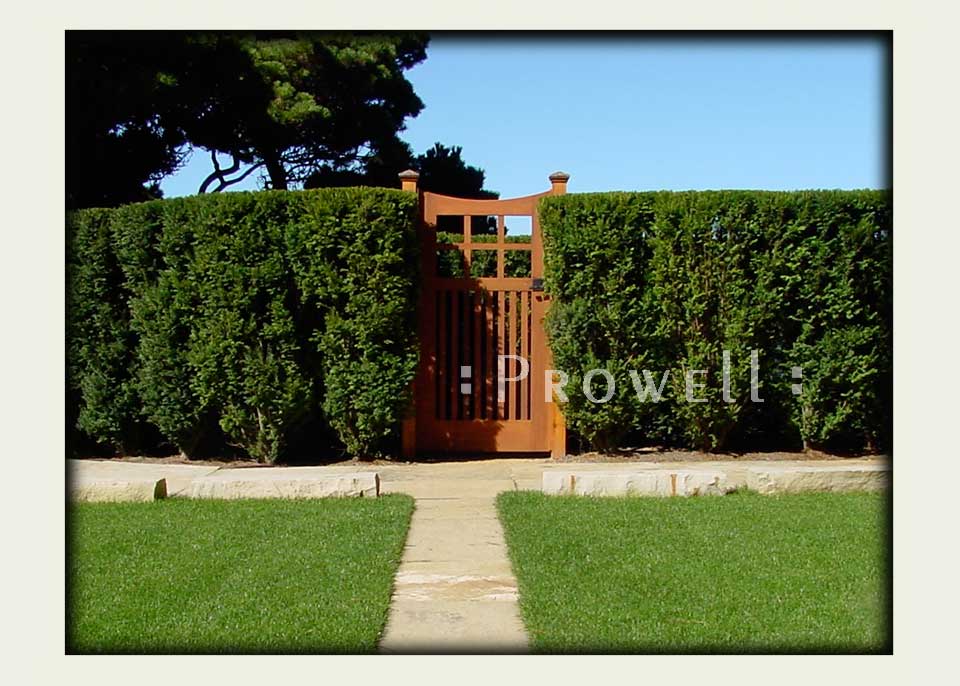 site photograph showing the arched wood gate as the service entry in Mendocino, California