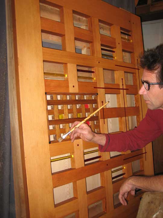 photograph taken in the wood shop of charles finishing the postmodern garden gate design 201