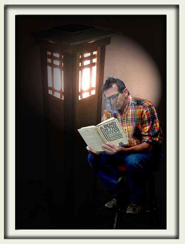Prowell reading by lighted garden column