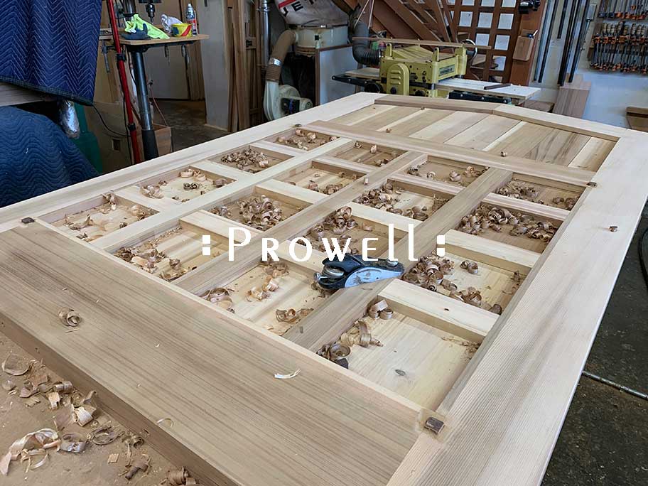 shop photo showing how to hand-plane the wooden entry gates #110